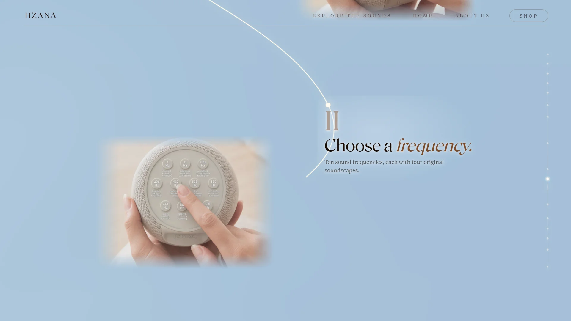 Hands choosing a frequency on the HZANA device.