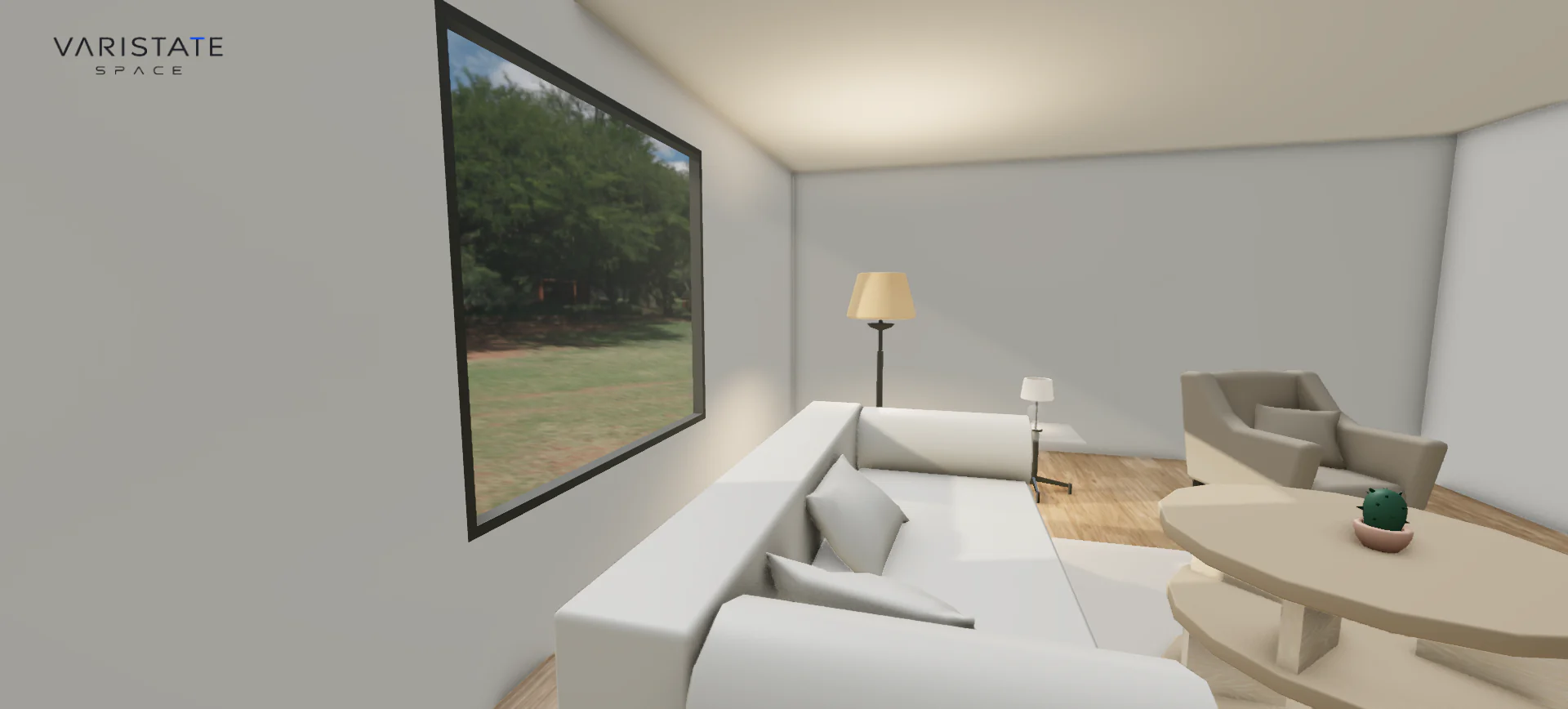 Eye-level daylight view of the furnished VariState SPACE atelier, beside the sofa and round coffee table.
