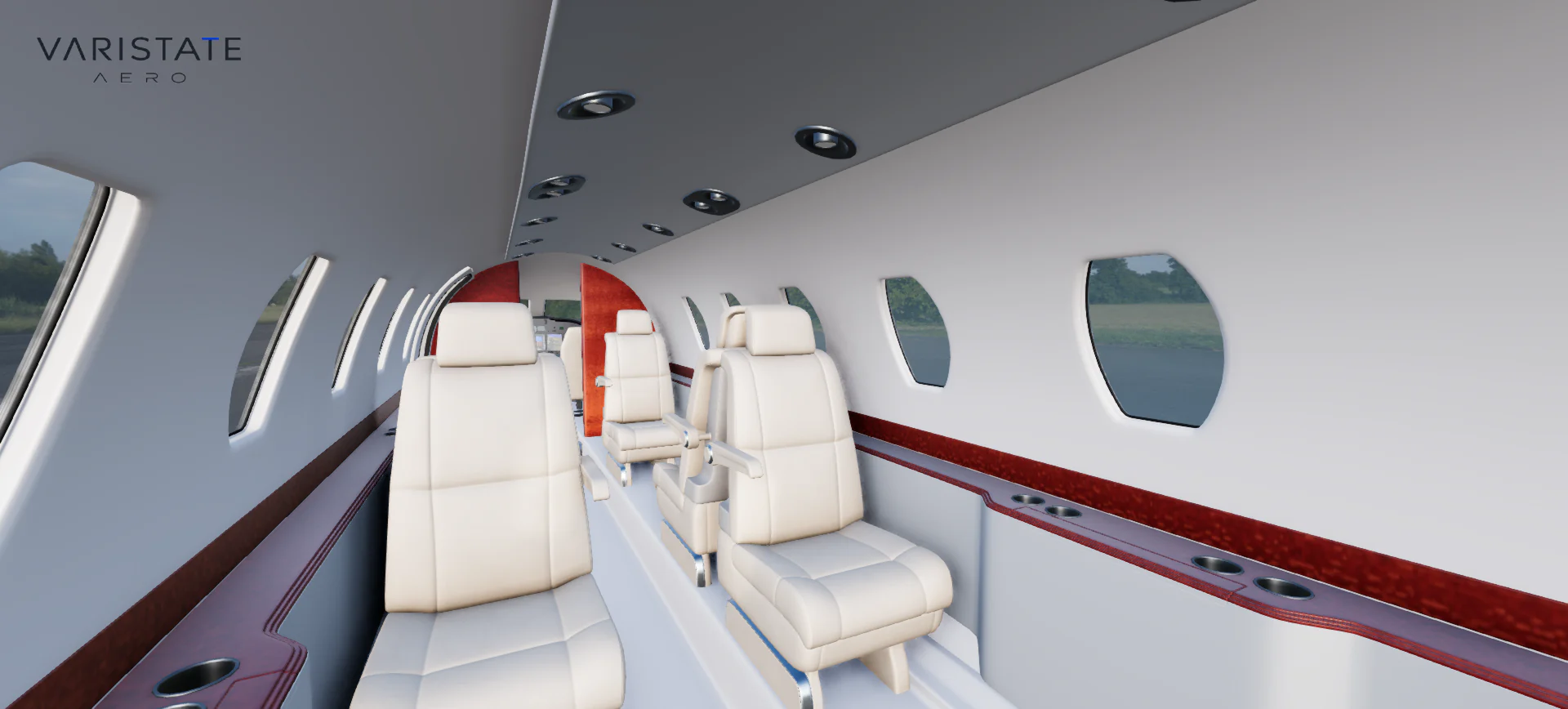 Cream passenger seats, pale cabin walls and red wood-style side ledges inside the VariState jet.