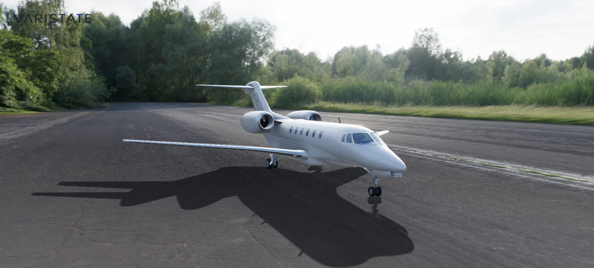 White VariState Aero private jet in a raised three-quarter view on a tree-lined runway.