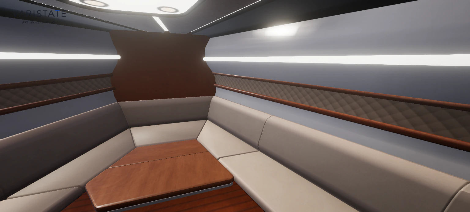Forward yacht saloon with cream seating, timber table, quilted trim, and ceiling lights.
